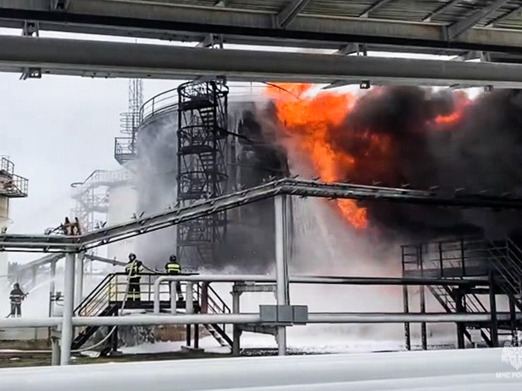 Firefigters battle a fire that hit an oil depot in the town of Klintsy where a Ukrainian drone dropped an explosive device previously.