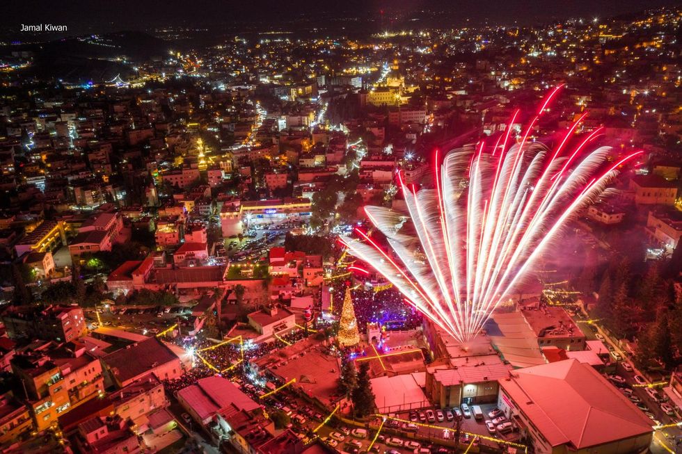 Fireworks during the inauguration of the Christmas tree lighting in the city of Nazareth, Israel.