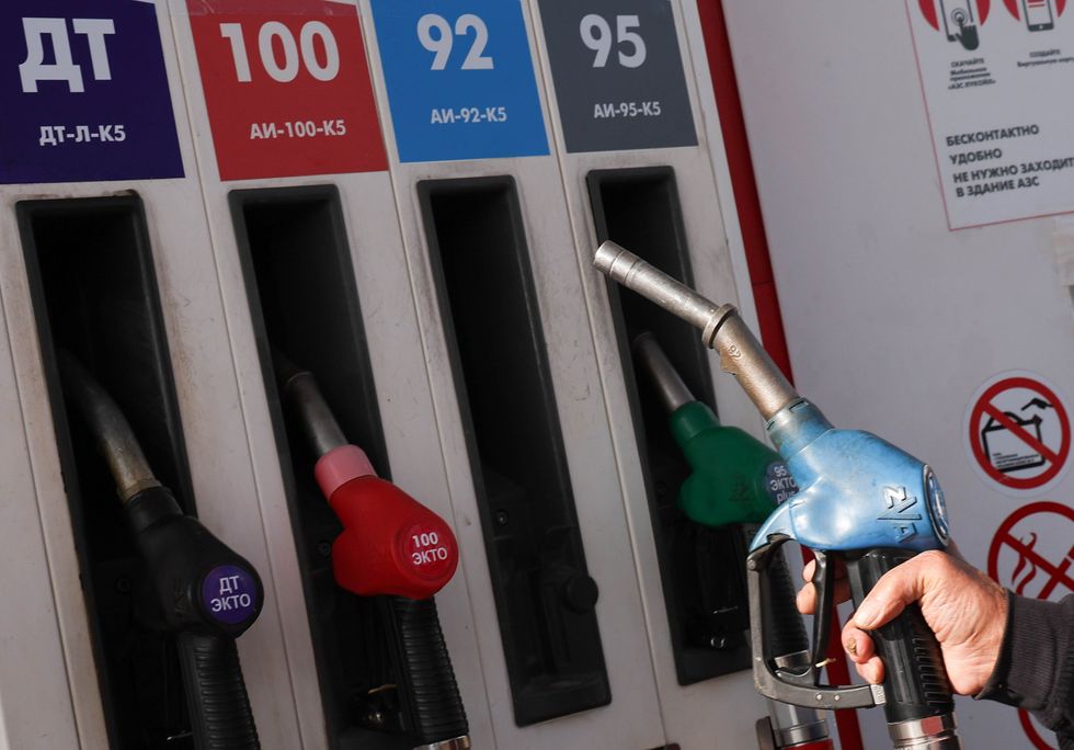 Four different Fuel Nozzles at a gas station