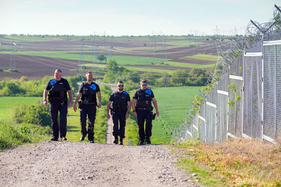 Four German Federal Police officers on Frontex duty walk along the Turkish-Bulgarian ''Green Border'' during the visit of German Interior Minister Faeser.