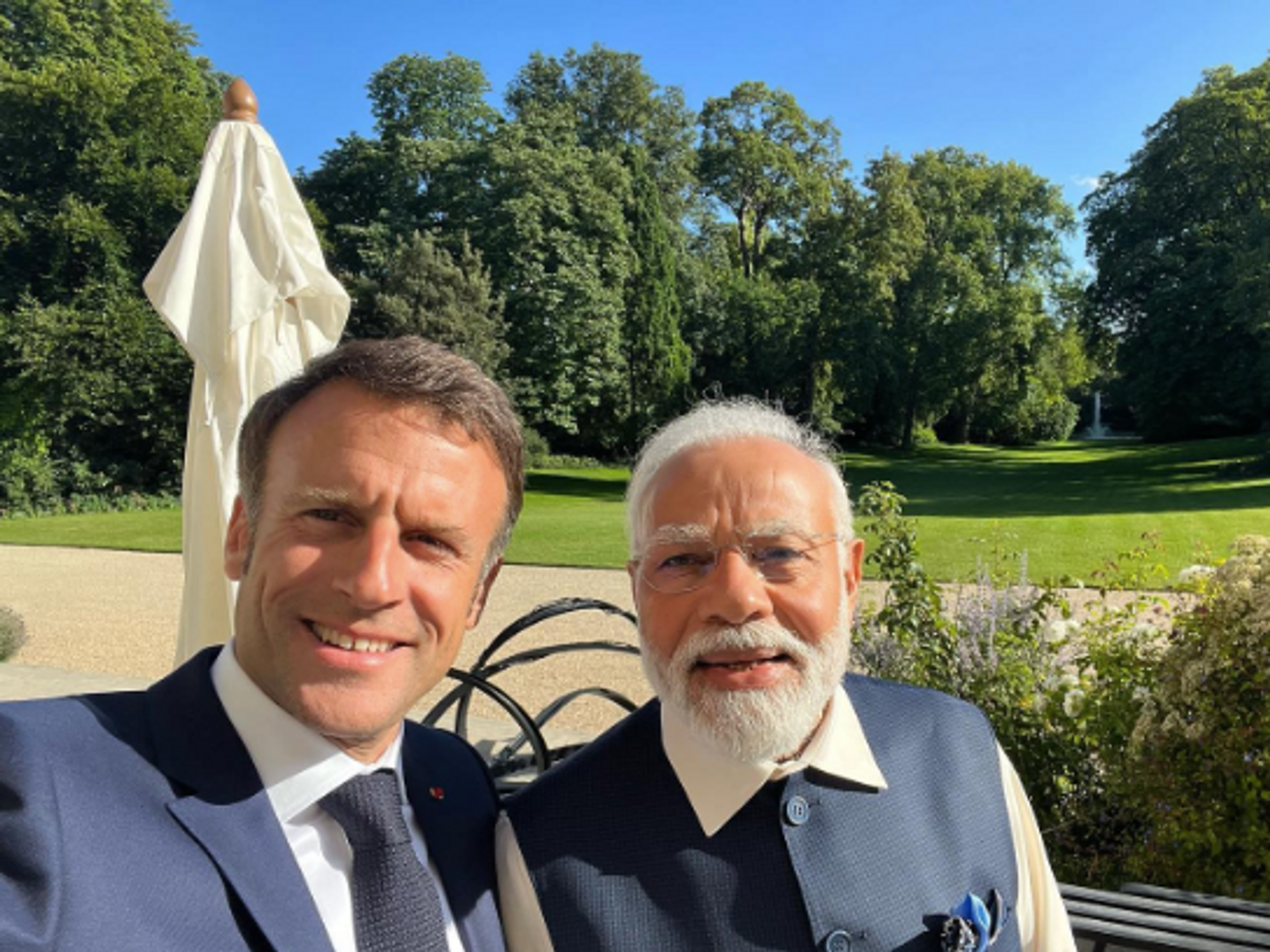 French President Emmanuel Macron and Indian Prime Minister Narendra Modi taking a selfie.