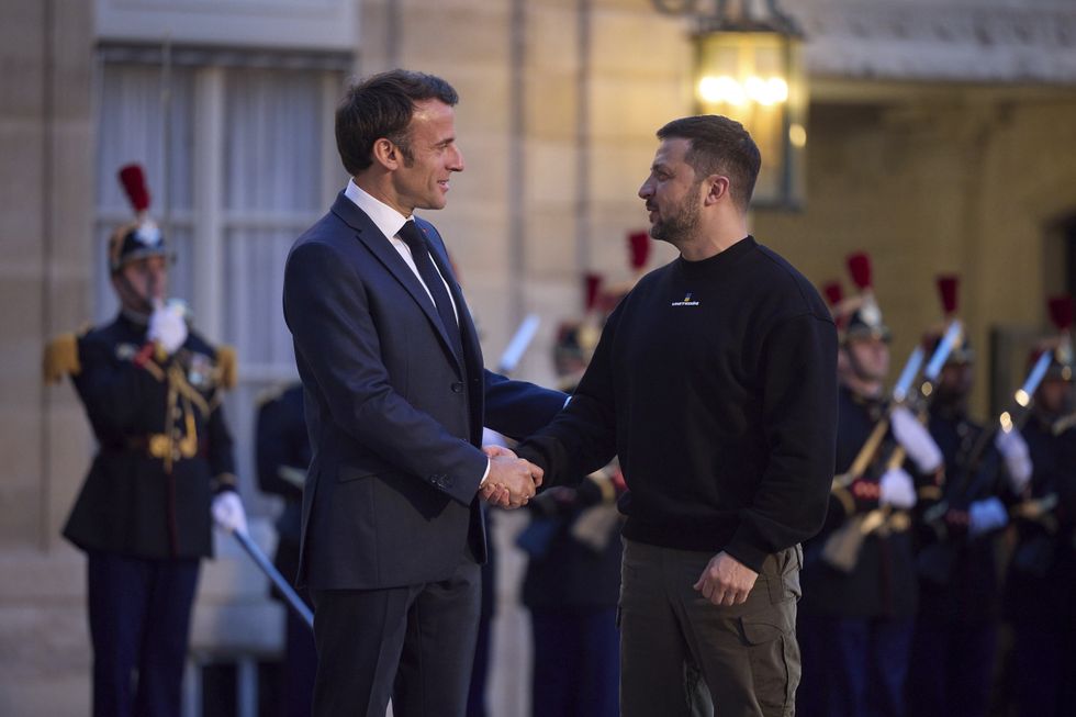 French President Emmanuel Macron welcomes Volodymyr Zelenskyy at the Elysee Palace on May 14.
