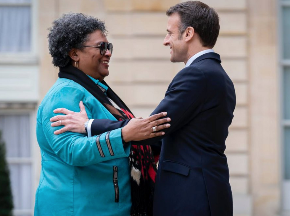 French President Emmanuel Macron with Mia Mottley, the Prime Minister of Barbados.