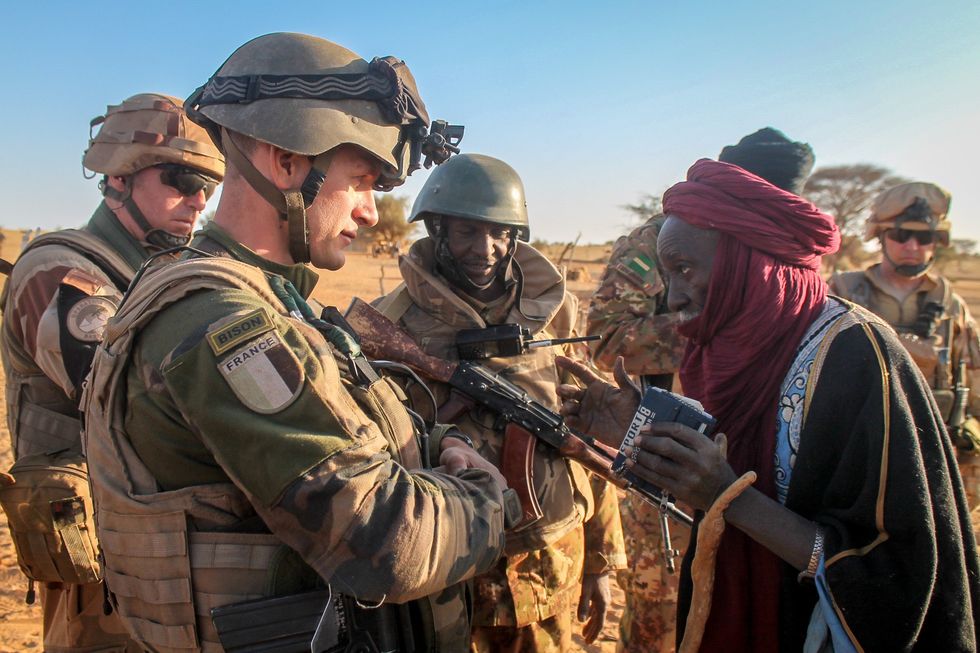 French soldiers talking to villager during Operation Barkhane.