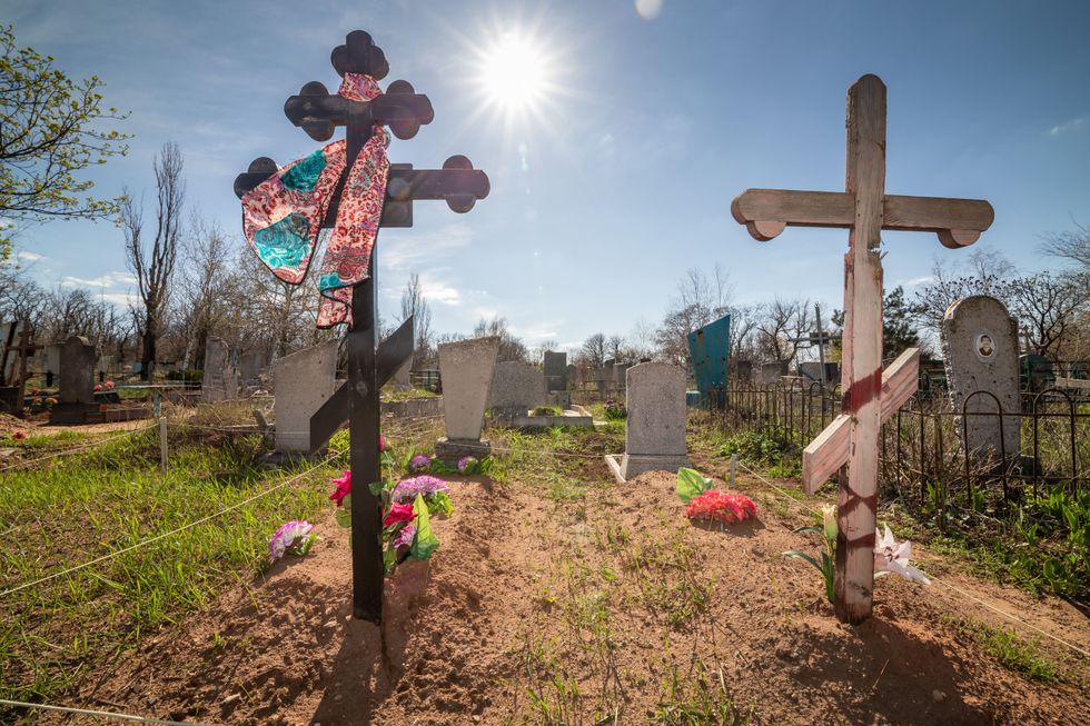 Fresh graves on the war line in the city of Avdiivka.