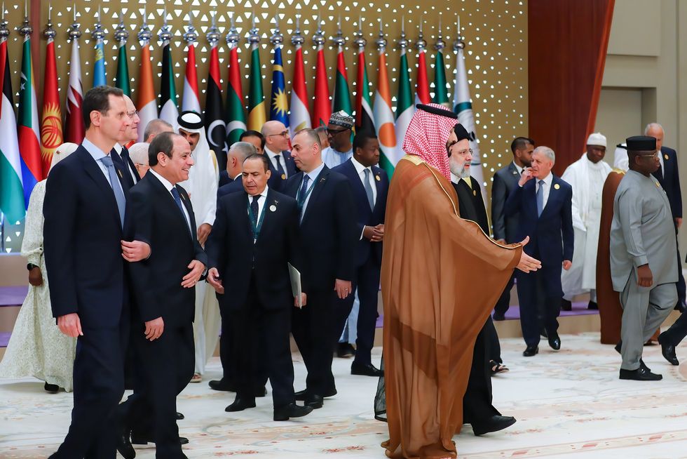 from left: Syria's President BASHAR AL-ASSAD, Lebanon's caretaker Prime Minister NAJIB MIKATI, Egypt's President ABDEL FATAH AL-SISI as they follow Saudi Crown Prince MOHAMMED BIN SALMAN (Front R) and Iran's President EBRAHIM RAISI (Back R) during an emergency summit of the Arab League and the Organisation of Islamic Cooperation (OIC) in Riyadh.