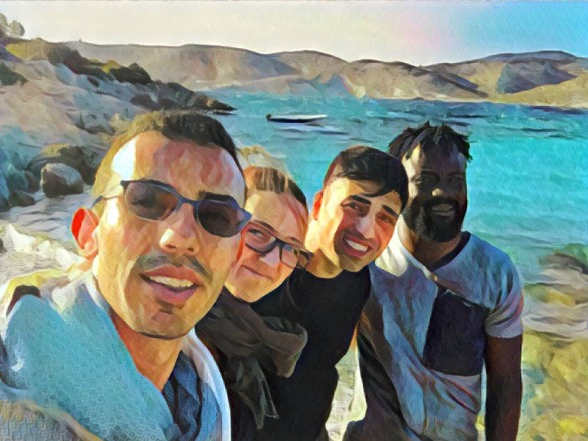 From left to right: the author, a volunteer and two refugees in Chios, Greece