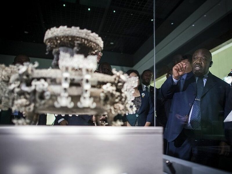Gabonese President Ali Bongo Ondimba behind a glass box.