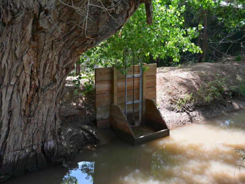 Gates control the flow of water into smaller ditches, providing irrigators with water to flood their land during the growing season.