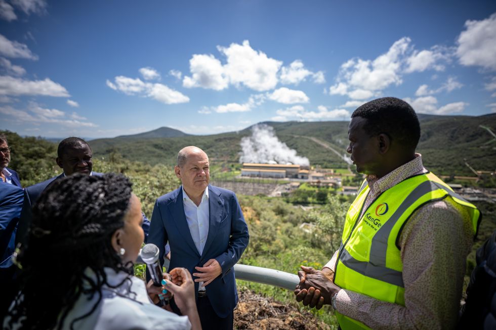 German Chancellor Olaf Scholz with Davies Chirchir, Minister of Energy in Kenya, and geophysicist Anna Mwangi, during a visit at Africa's largest geothermal plant in Olkaria on Lake Naivsha.