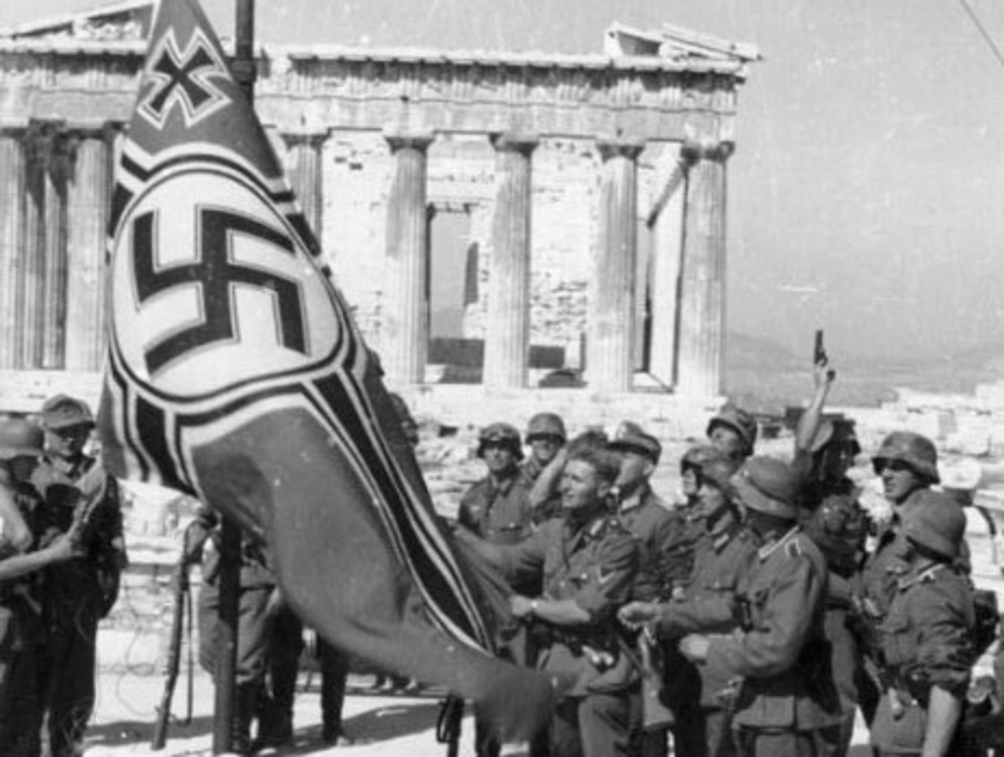German soldiers raise their flag over the Acropolis in Athens, Greece (1941)