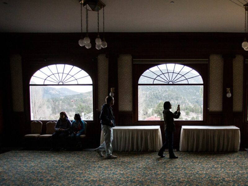 Ghost hunters photography a haunted ballroom in the hopes of catching a ghost in one of the photos at the Shining's Stanley Hotel in Colorado, USA.