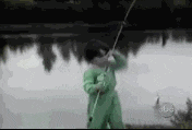 GIF of a child scared by the fish he's just caught