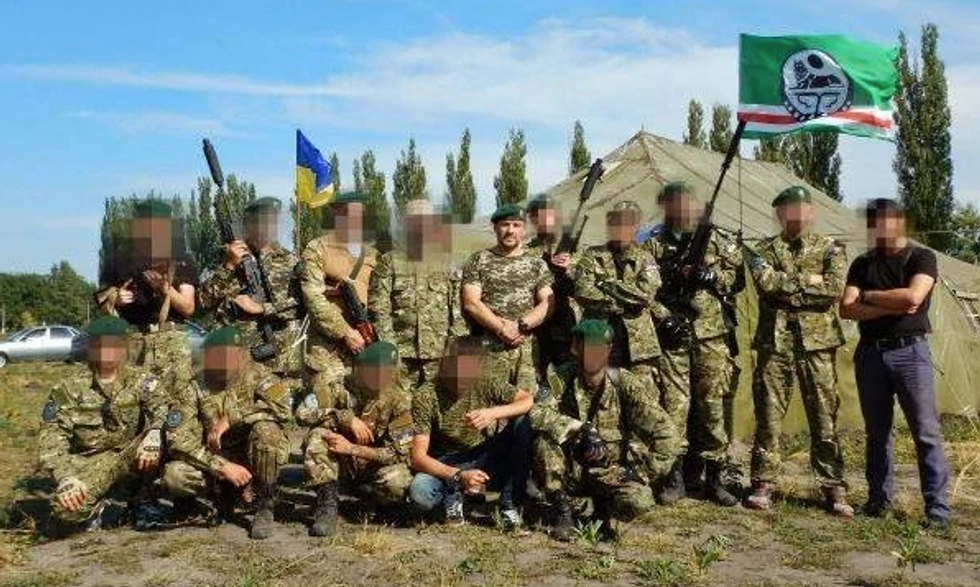 Group photo of members of the Sheikh Mansour battalion posing together