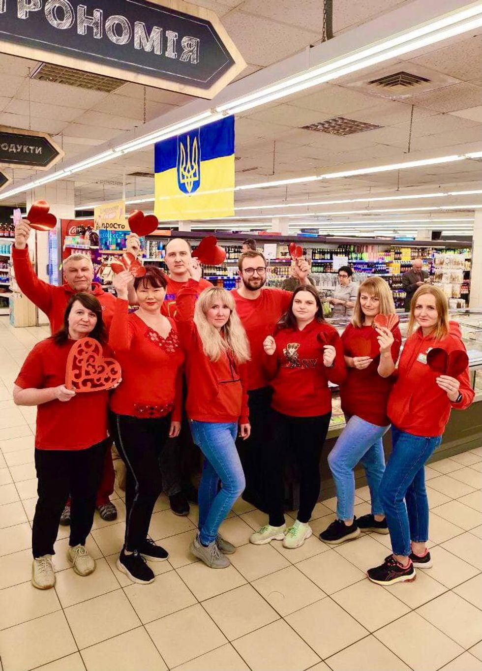 Group photo of workers at a Silpo supermarket in Ukraine
