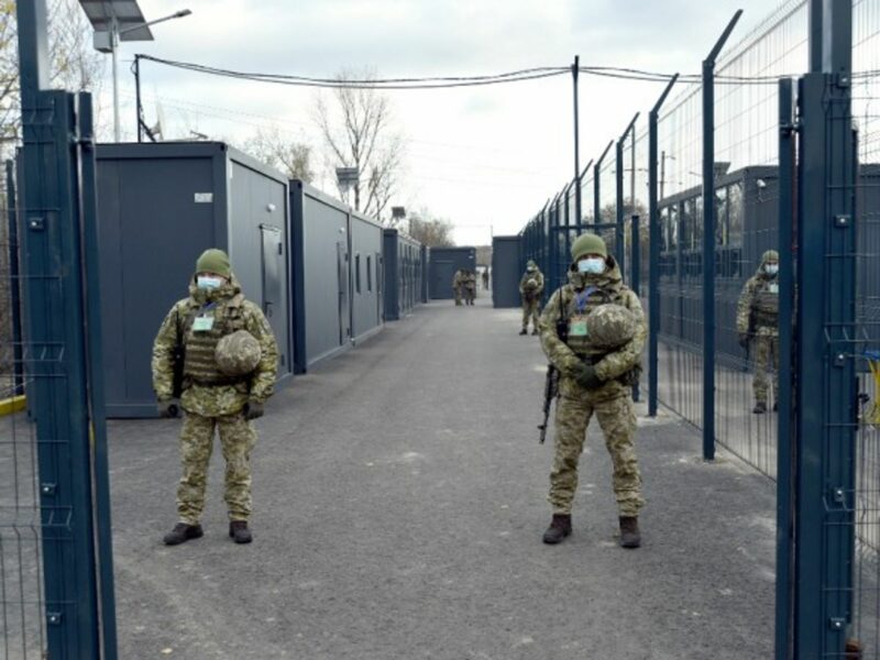 Guards on the premises of an entry exit checkpoint in Donbass