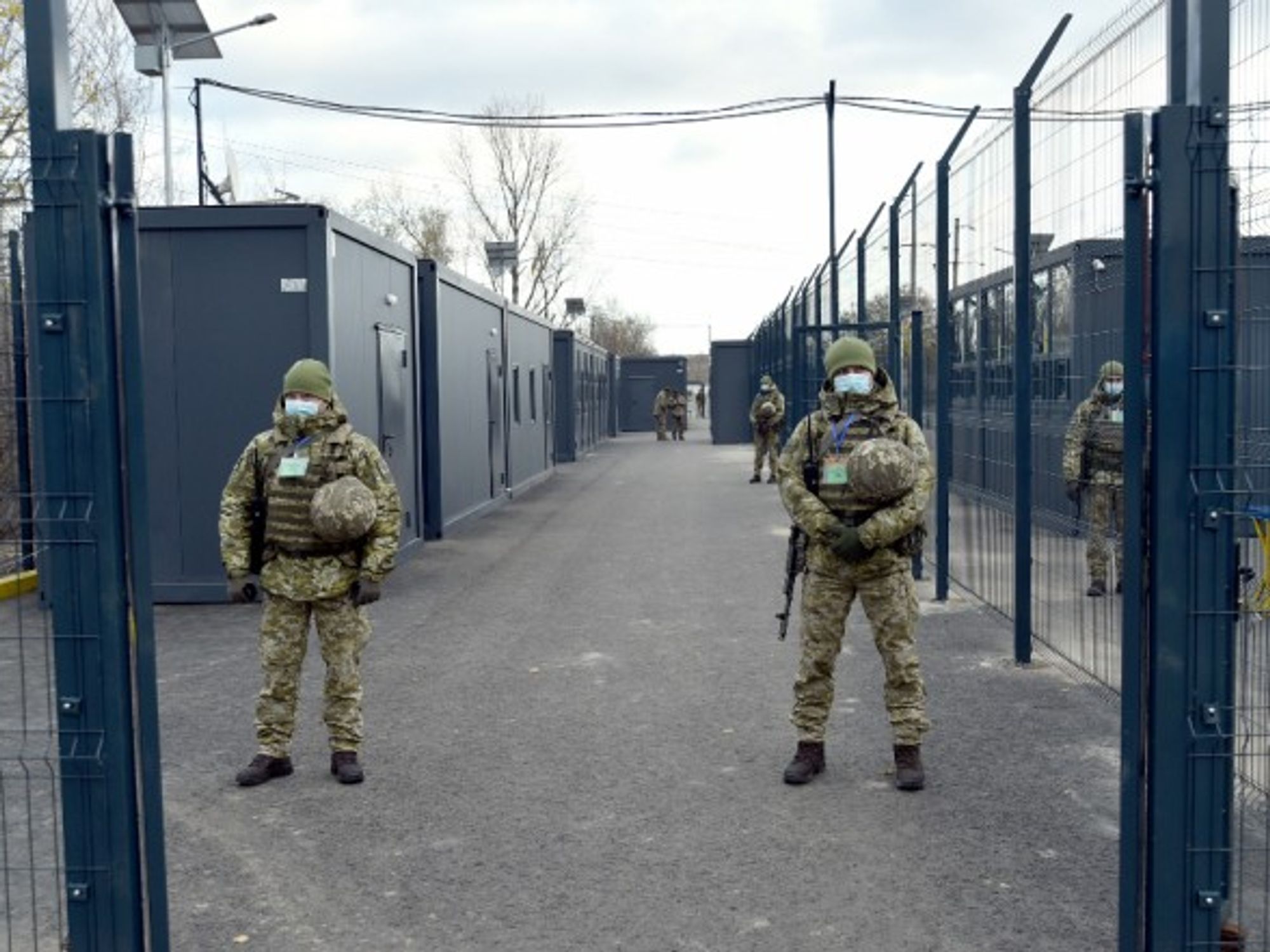 Guards on the premises of an entry exit checkpoint in Donbass