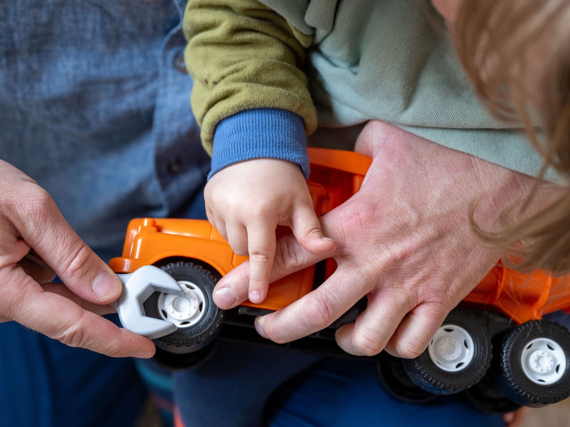 Hands of a father and a son.