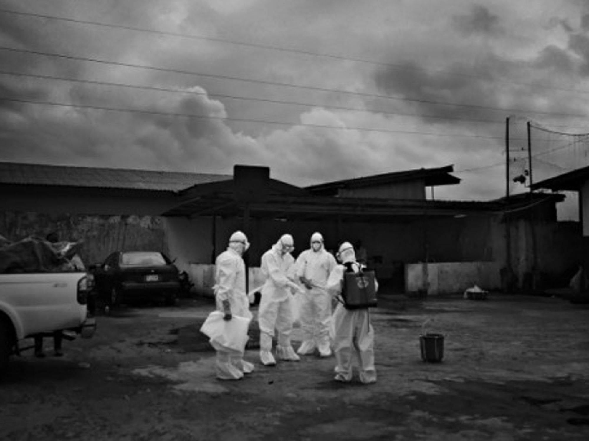 Hazmat-suited workers fighting Ebola in Unification Town, Liberia on Aug. 30