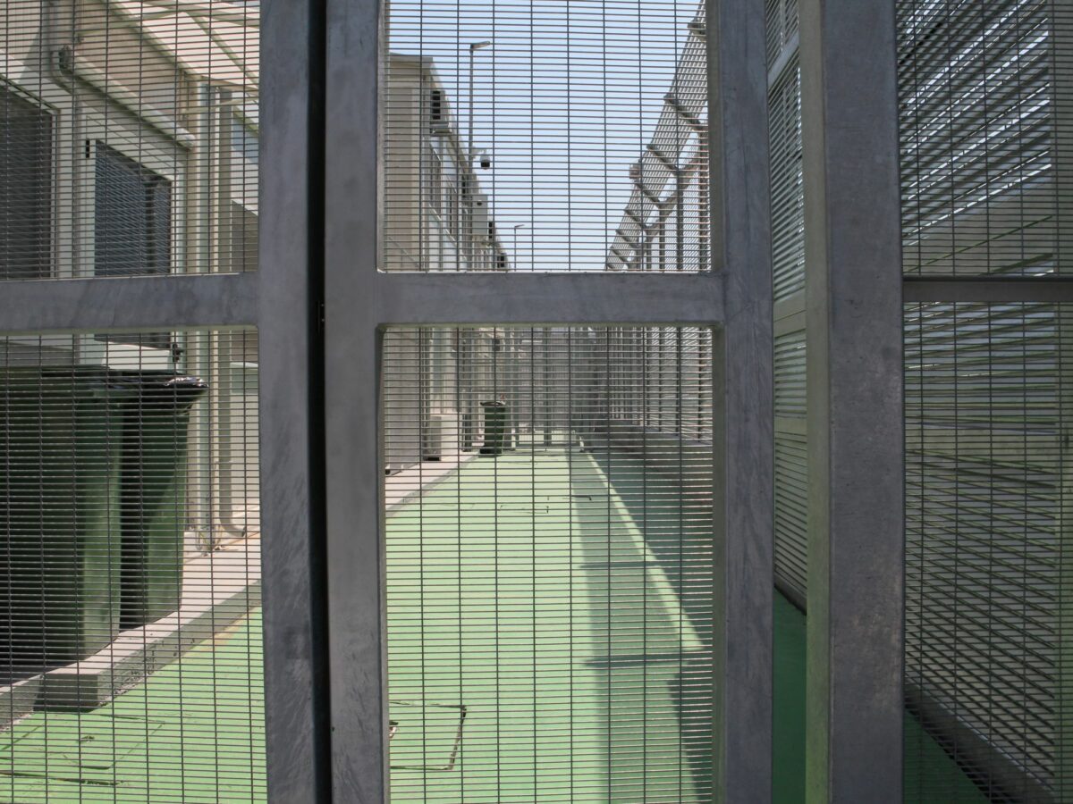 High fences stand in the Italian arrival camp for refugees in the port city of Shengjin in northern Albania. Italy is currently building a large reception camp for Mediterranean refugees in Gjader,
