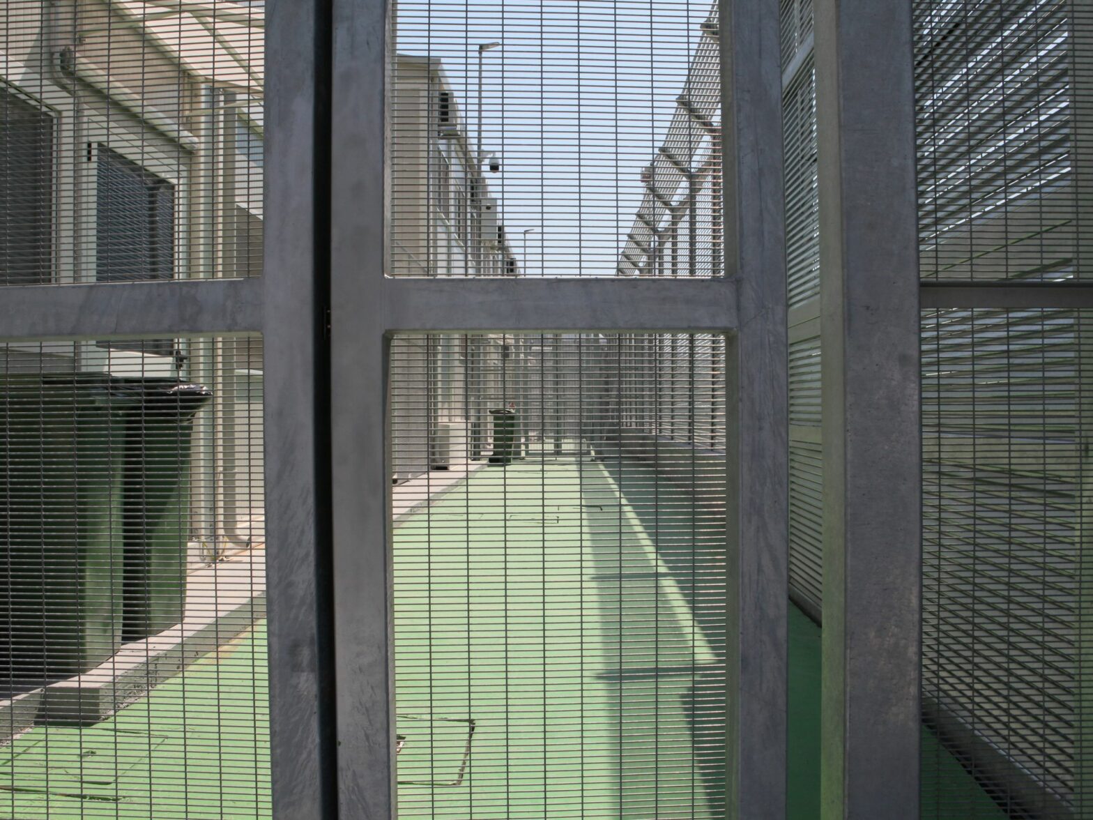 High fences stand in the Italian arrival camp for refugees in the port city of Shengjin in northern Albania. Italy is currently building a large reception camp for Mediterranean refugees in Gjader,