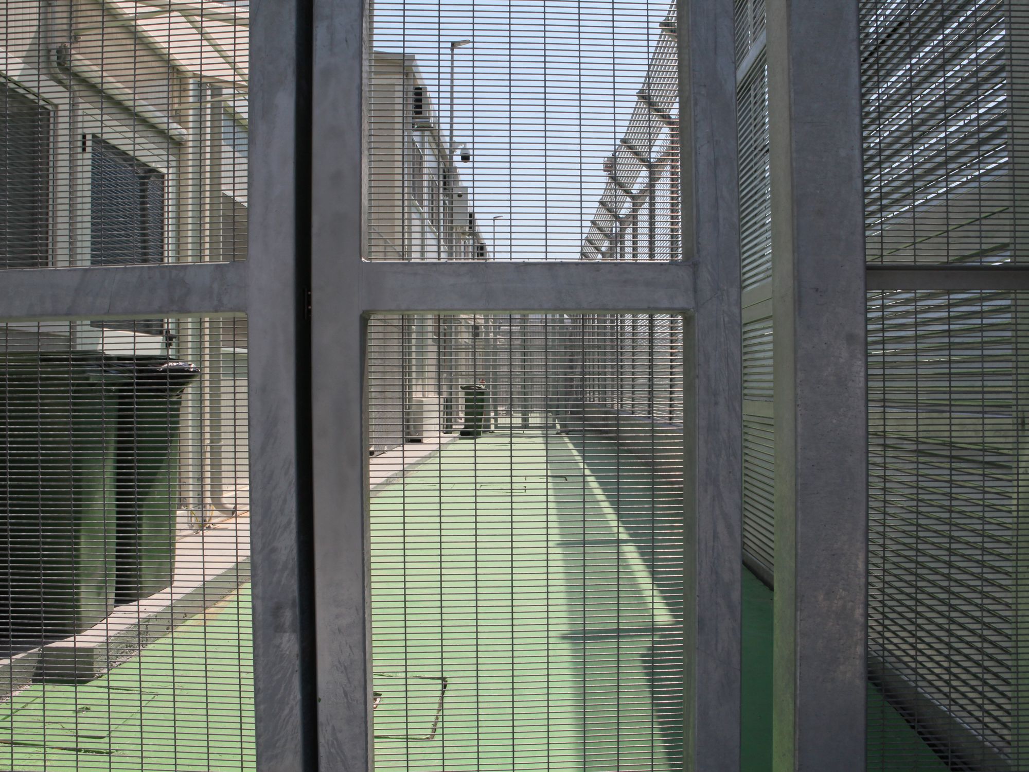 High fences stand in the Italian arrival camp for refugees in the port city of Shengjin in northern Albania. Italy is currently building a large reception camp for Mediterranean refugees in Gjader,