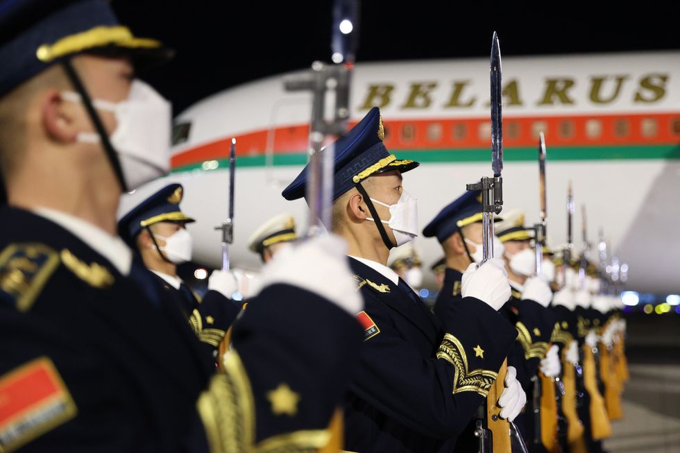 Honour guards are seen during a welcoming ceremony for Belarus' President Alexander Lukashenko at Beijing airport