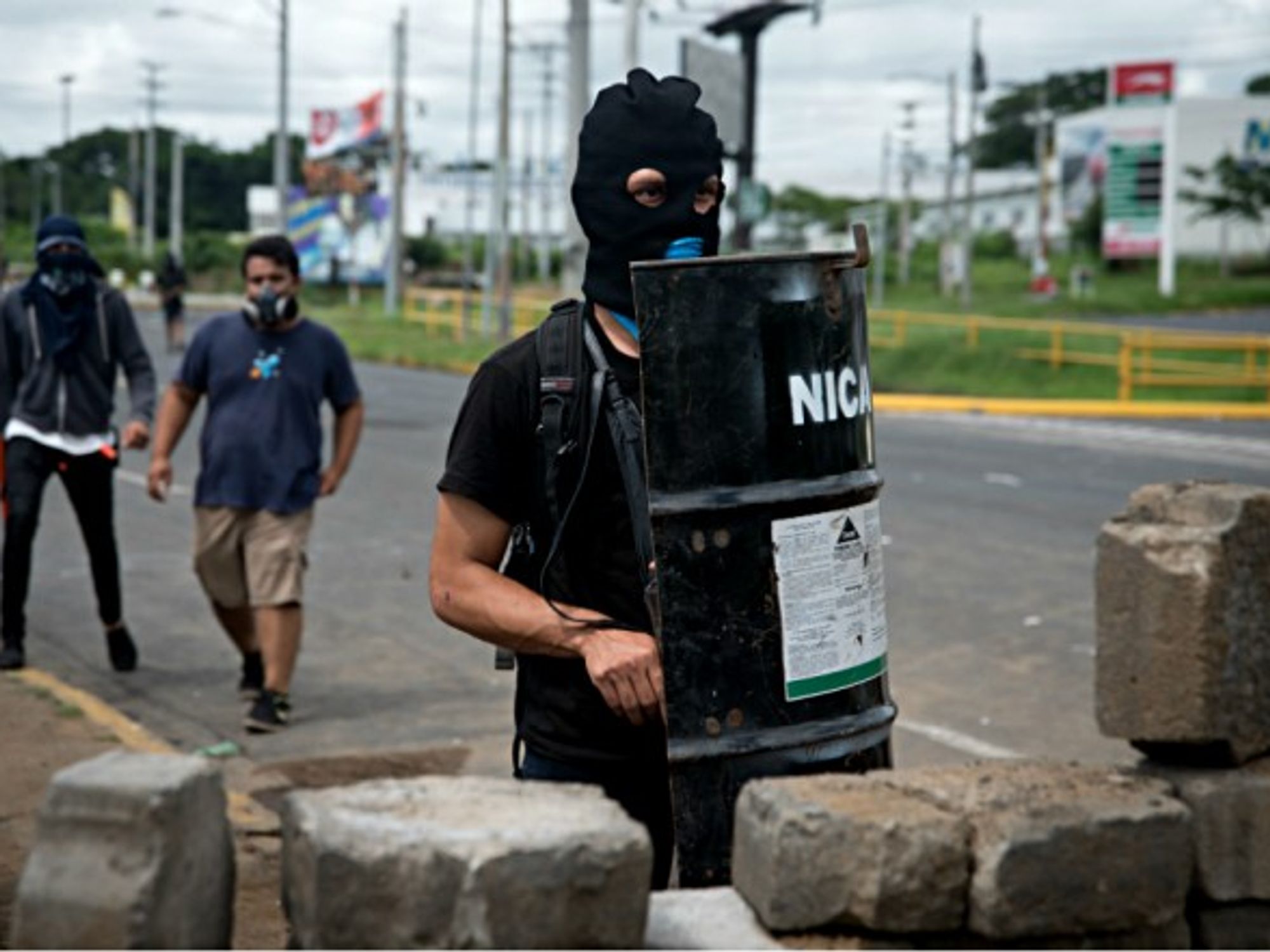 Hooded students Managua, Nicaragua guard their university from Ortega's paramilitaries who storm campuses and injure dozens