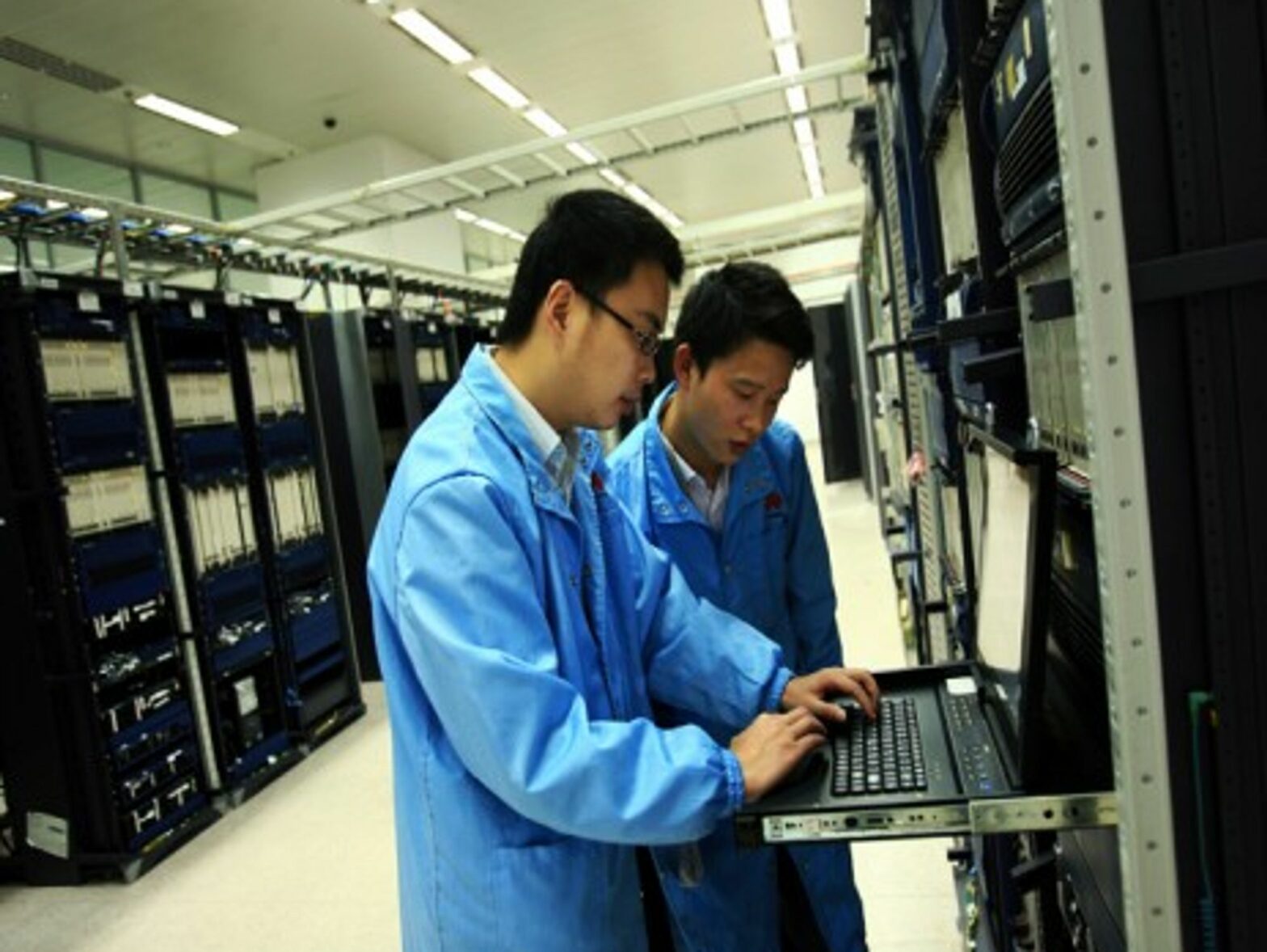 Huawei staff performing routine maintenance