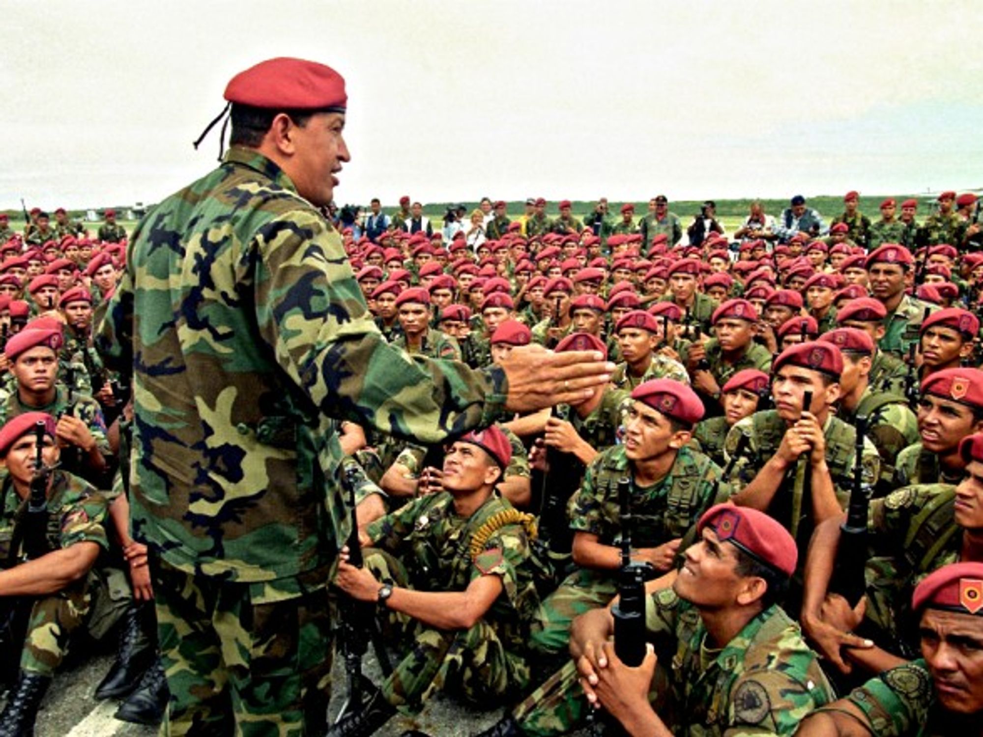 Hugo Chavez talking to soldiers in Vargas in 1999