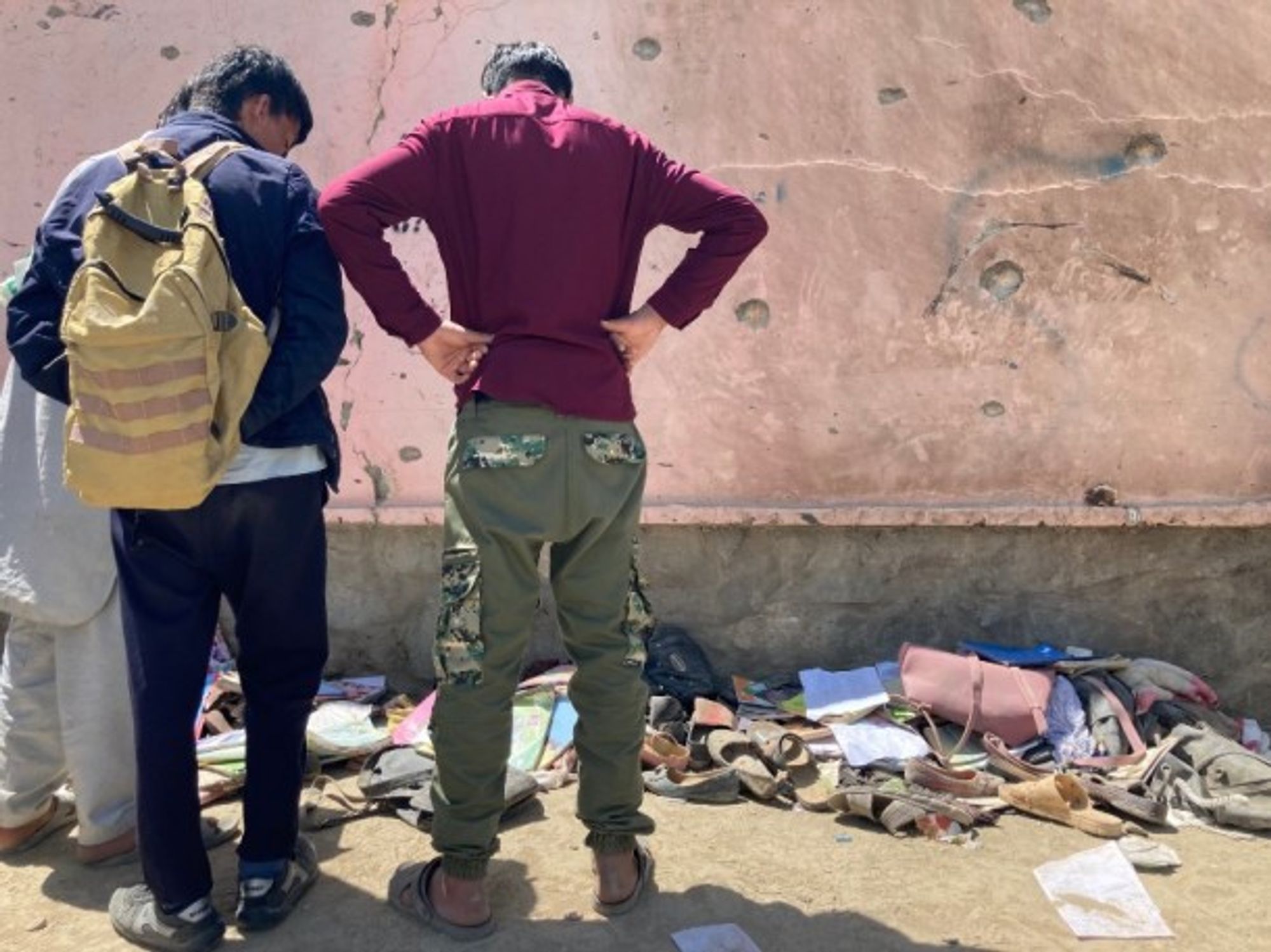 Hundreds of people gathered at the scene where an attack claimed over 50 lives at a school in Kabul, Afghanistan, on May 9, 2021.