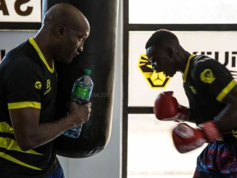 Idrissa Gueye (right) trains with his coach, world champion Souleymane Mbaye, on Sept. 20, 2019, in Dakar