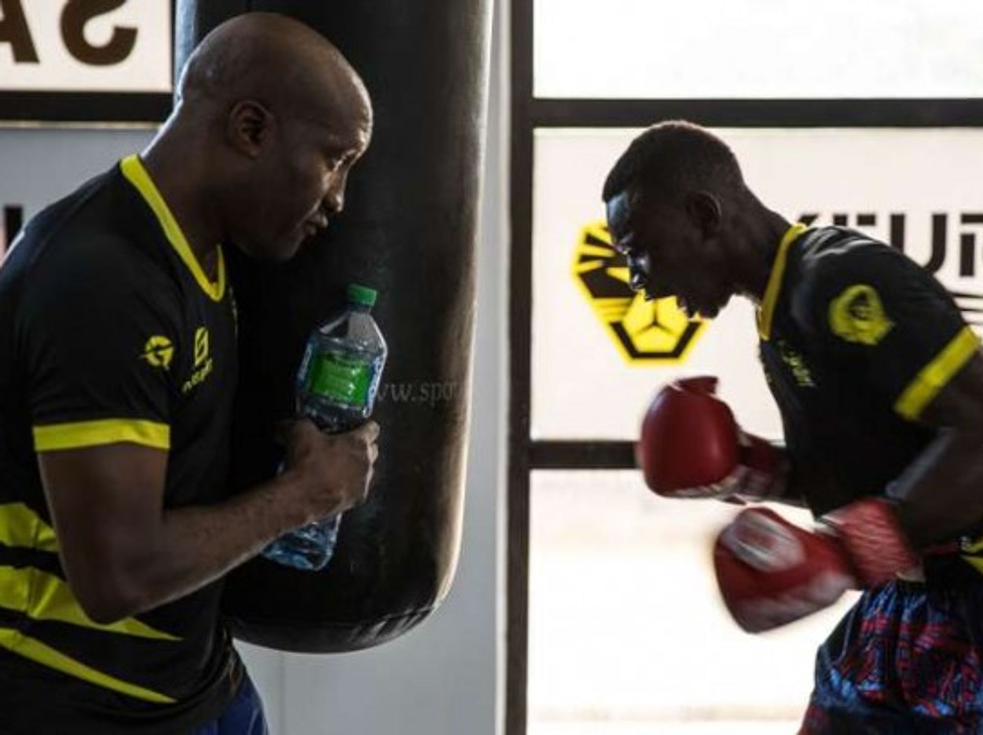 Idrissa Gueye (right) trains with his coach, world champion Souleymane Mbaye, on Sept. 20, 2019, in Dakar