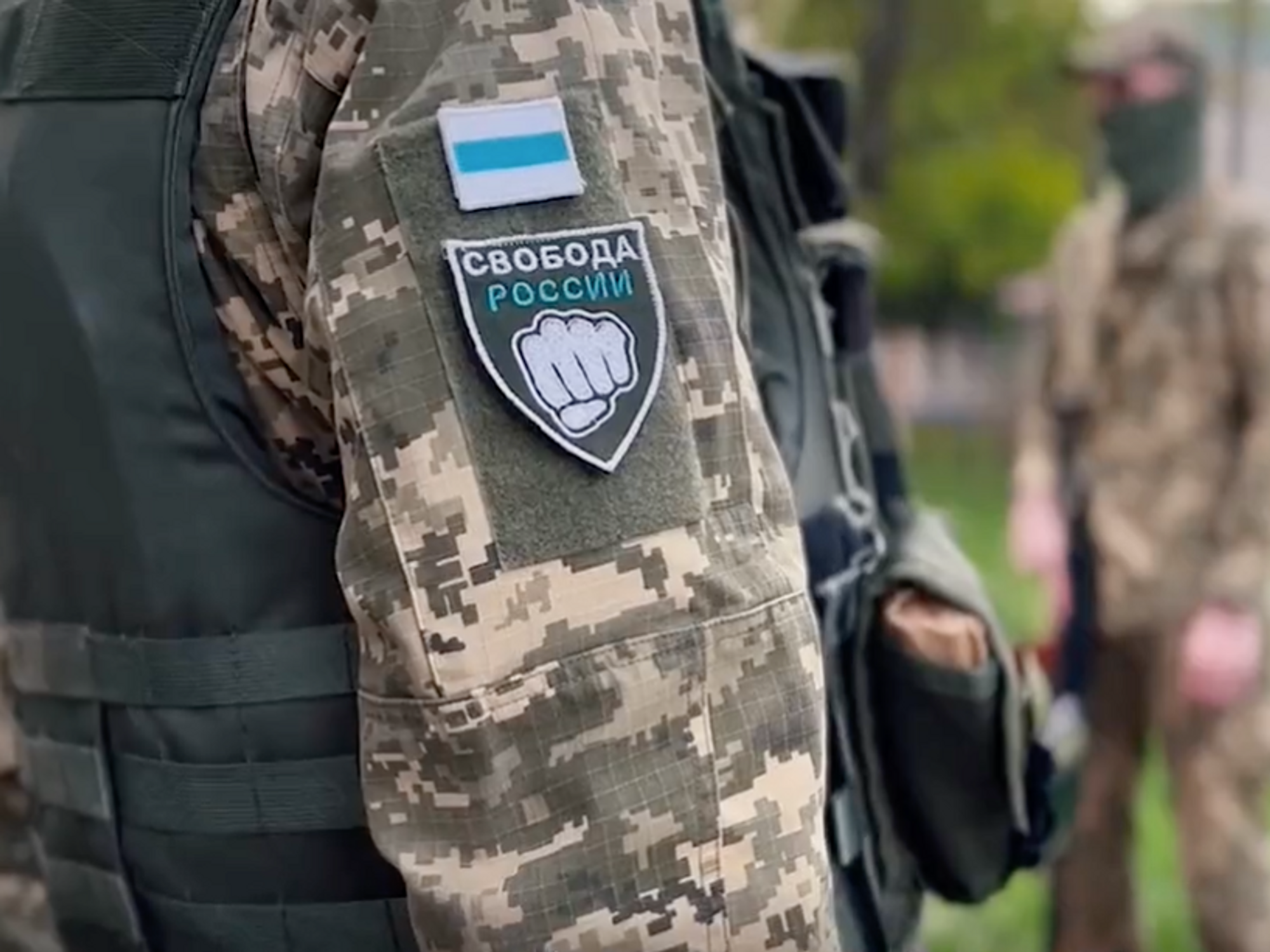 Image of a close up on a russian soldier's badge with a fist on it.