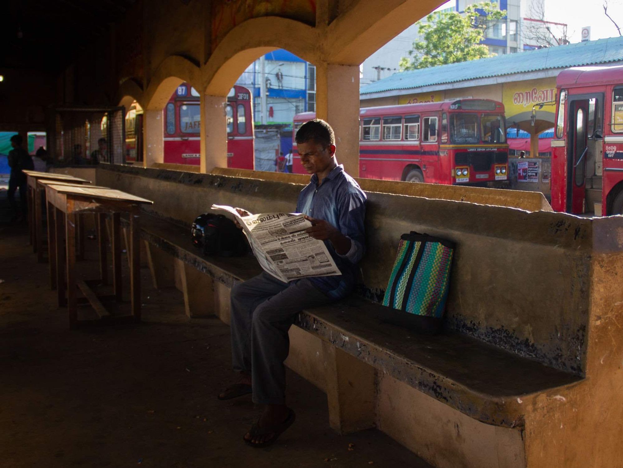 Image of a man reading a newspaper