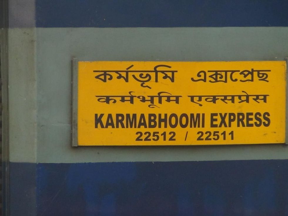 image of a sign on the train saying "22512 Karmabhoomi Express"