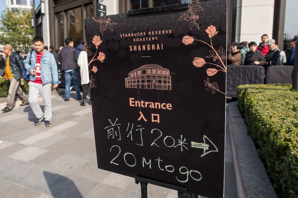 image of a sign pointing to Starbucks