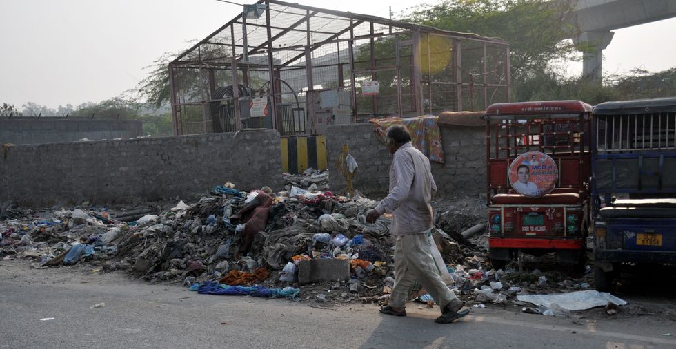 image of a slum and a man