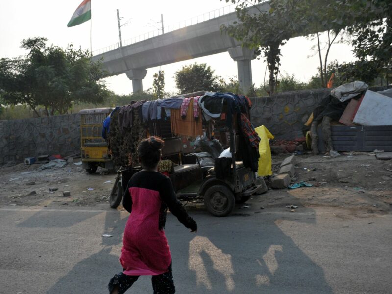 image of a slum with a girl