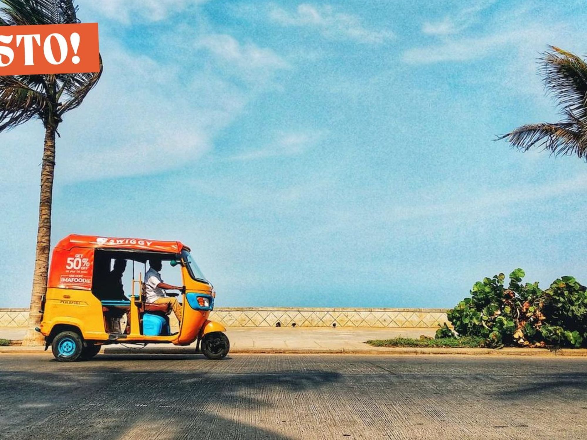 Image of a tuktuk driver driving along the Pondicherry coast​