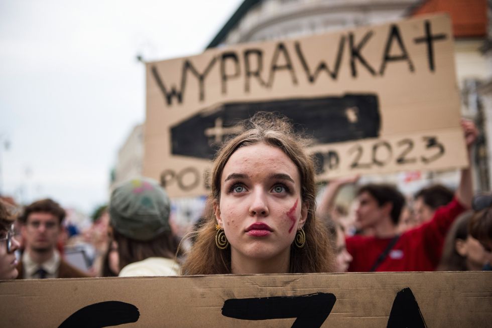 Image of a woman at a protest against harsh abortion laws in Poland