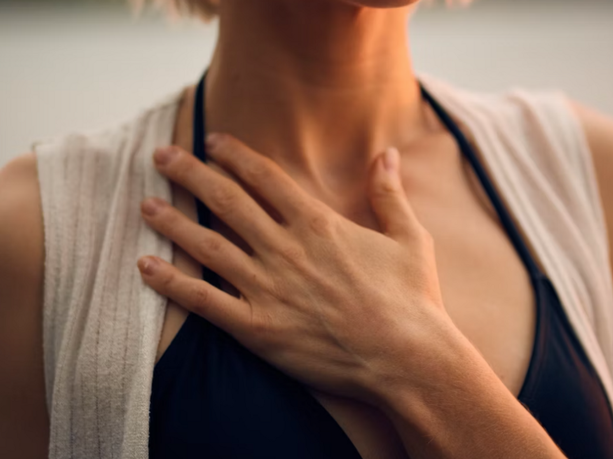 image of a woman with her hand on her chest