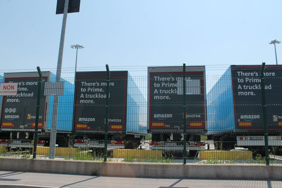 Image of Amazon trucks outside the Castelguglielmo facility in the province of Rovigo, Italy.