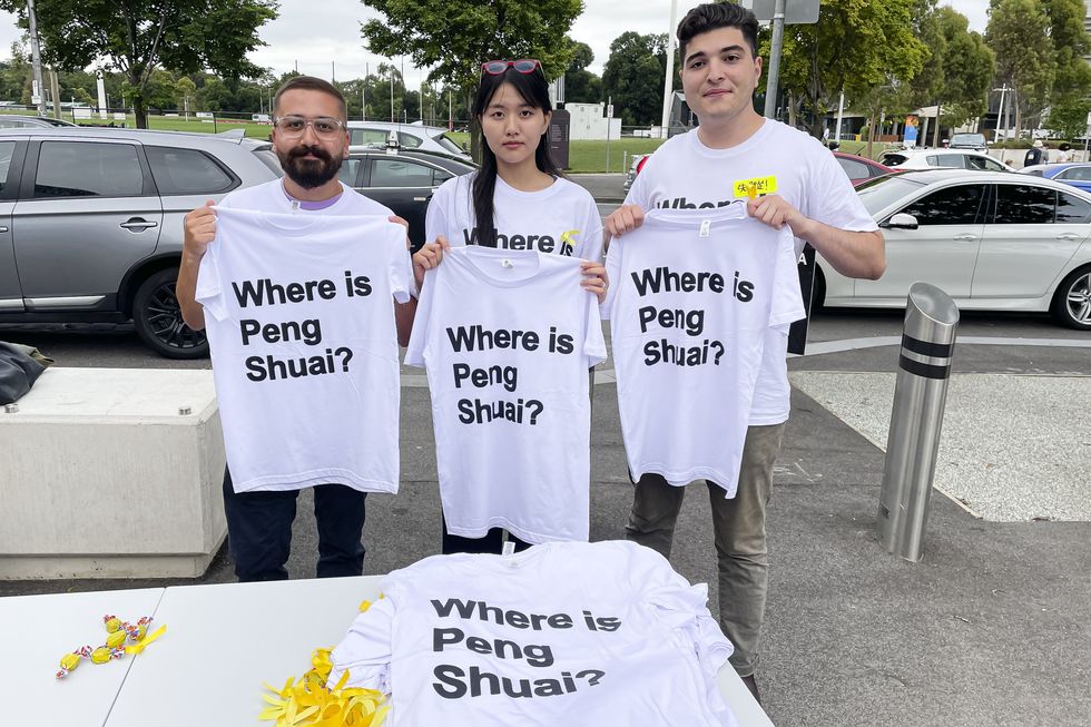 Image of An activist group handing out T-shirts reading ''Where is Peng Shuai?'' before the women's Grand Slam final in Australia