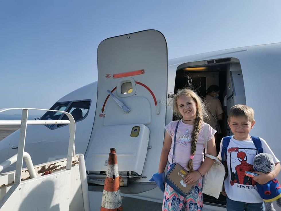 image of children getting on a plane