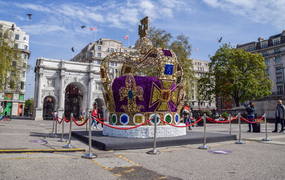 Image of ​A crown installation decorates London's Marble Arch ahead of the coronation of King Charles III.