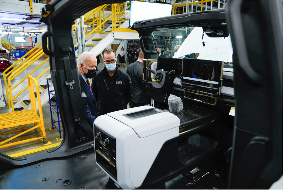 Image of ​President Joe Biden views the electric Hummer assembly line at the General Motors Detroit, Michigan, U.S.A, in 2021.