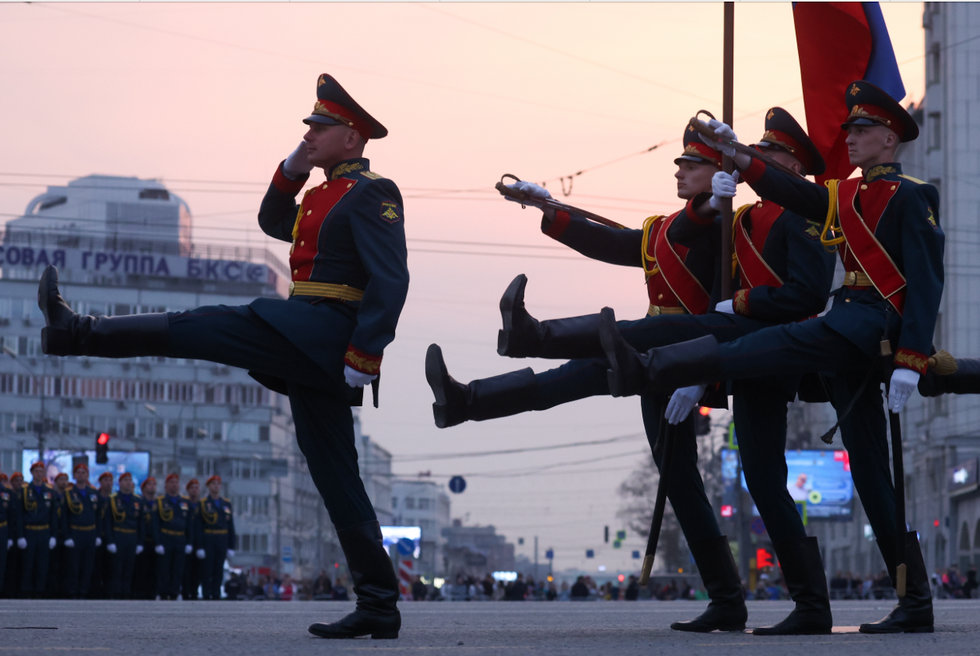 Image of ​Servicemen march during a rehearsal of a military parade