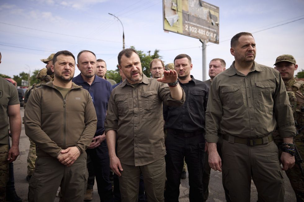 Image of ​Ukrainian President Volodymyr Zelensky and Internal Affairs Minister Ihor Klymenko at the flooded Kakhovka hydroelectric power plant.
