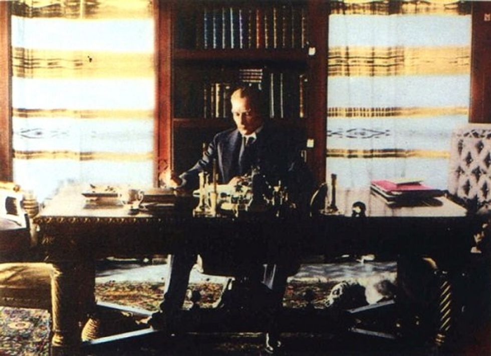 Image of Former Turkish president Atatürk at the library of Çankaya Köşkü Presidential Residence. His dog Foks can be seen lying on the floor, under the table.